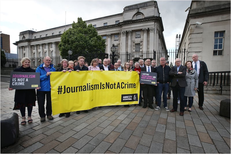 Supporters with journalists Barry McCaffrey and Trevor Birney outside the High Court in Belfast. Picture by Hugh Russell&nbsp;
