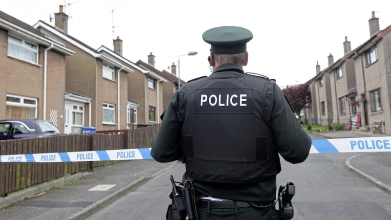 Coulson Avenue in Lisburn sealed off as a murder investigation gets underway. Picture by Ann McManus. 