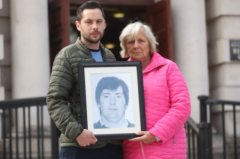Christopher McNally and his mother Pauline hold a photo of his father Phelim. Picture by Mal McCann