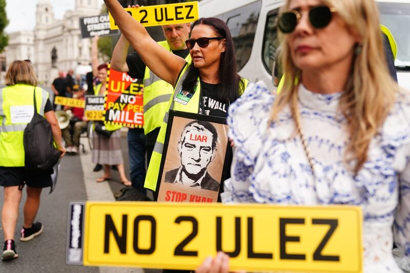 Protesters gathered outside Downing Street in central London on the first day of the expansion of the ultra-low emission zone