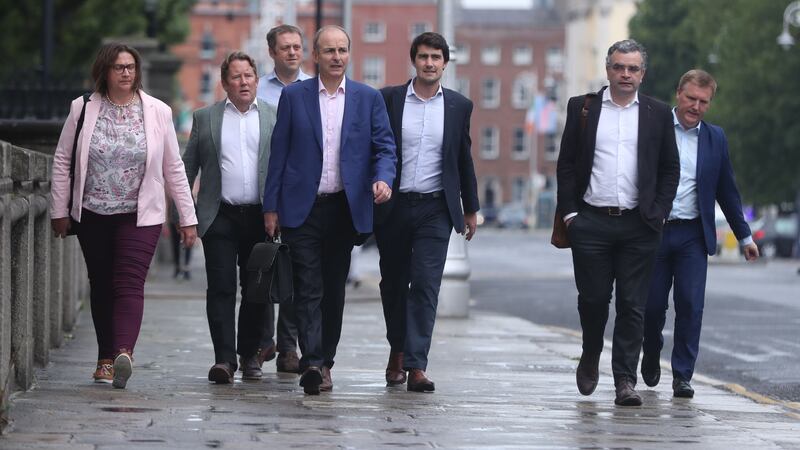 &nbsp;Fianna Fail leader Micheal Martin (centre) arrives at Government Buildings in Dublin to discuss outstanding issues, as leaders of Fine Gael, Fianna Fail and the Green Party are set to formally agree a draft programme for government between their parties later.