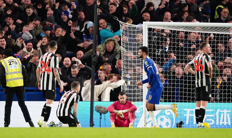 Newcastle’s Kieran Trippier, centre left, and Martin Dubravka are left dejected on the ground after Chelsea’s equaliser