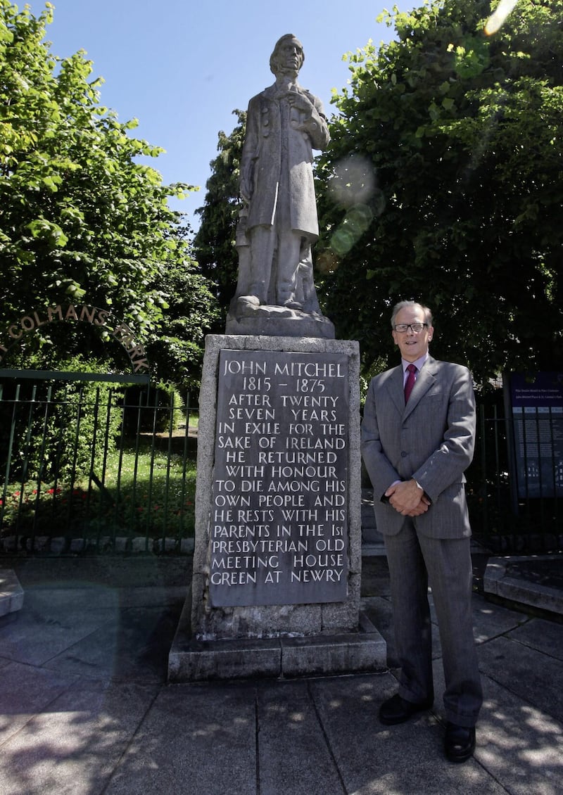 Anthony Russell, author of the John Mitchel biography Between Two Flags, pictured beside a statute of the Irish nationalist and political journalist in Newry. Picture by Ann McManus 