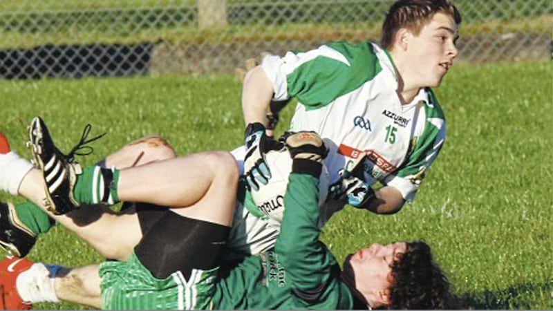 John Cunningham of St Malachy&rsquo;s, Castlewellan does his best to get away from the close marking of Dean Burgess of Loreto CC, Milford during the 2009 Markey Cup quarter-final clash in Dromore 