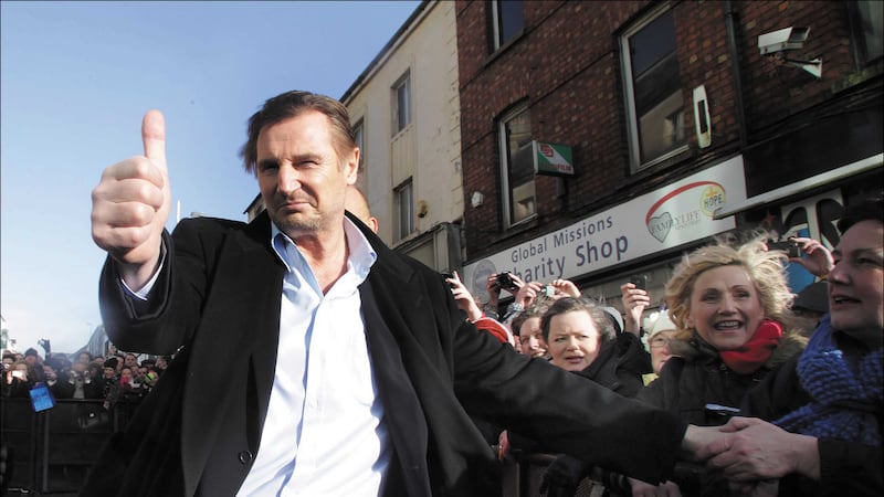 Liam Neeson has thrown his weight behind a rally demanding more jobs in his hometown of Ballymena