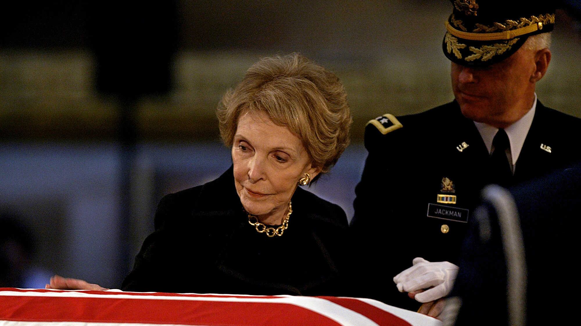 Former first lady Nancy Reagan says goodbye to her husband, former President Ronald Reagan, shortly before his body was removed from the Rotunda of the US Capitol in Washington in June 2004