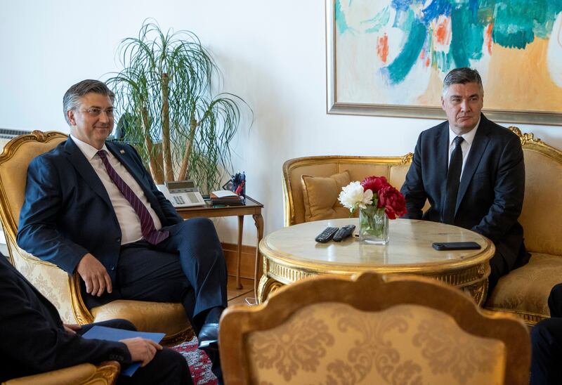 Andrej Plenkovic, left, meets President Zoran Milanovic at the presidential palace in Zagreb, Croatia, on Friday (AP)