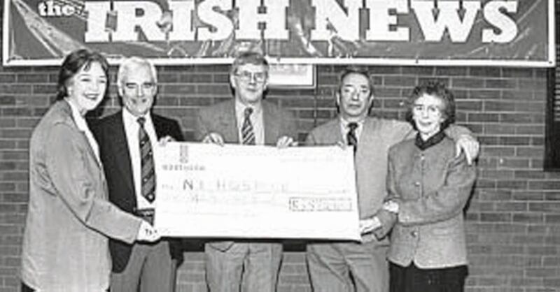 SMILING THROUGH...Whatever about the score on the green a grand total of &pound;3570 was raised for Beaconfield and NI Hospice. Pictured holding the cheque is Ray McClean (Irish News) ( centre) with l to r Lynn Davidson (Beaconfield House), Harry McMurry (NI Hospice), and the event organisers Arthur and Jean Donnelly