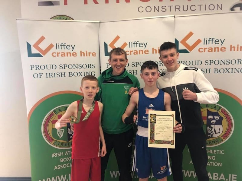 Holy Trinity's James Kelly (left) and Kyle Smith with coach Michael Hawkins and the club's 2018 European junior bronze medallist Jon McConnell
