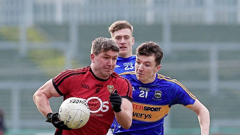 Down&#39;s Peter Turley strides away from Tipperary&#39;s Jack Kennedy. Picture: Philip Walsh 
