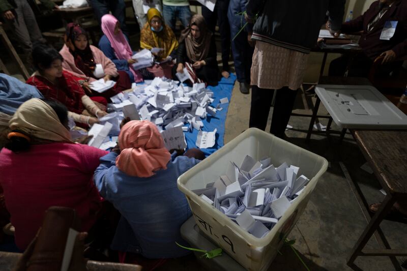 Bangladeshi polling officials count votes (AP)