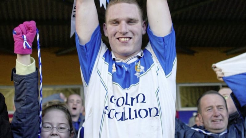 Ballinderry captain Adrian McGuckin holds the Andy Merrigan Cup aloft after victory over Nemo Rangers in the All-Ireland Club final. Pic John McAviney 