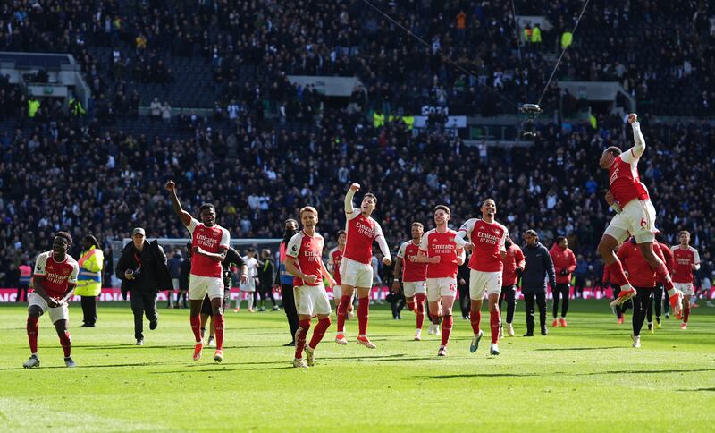 Arsenal celebrated a vital win away to rivals Tottenham that kept them at the top of the Premier League table