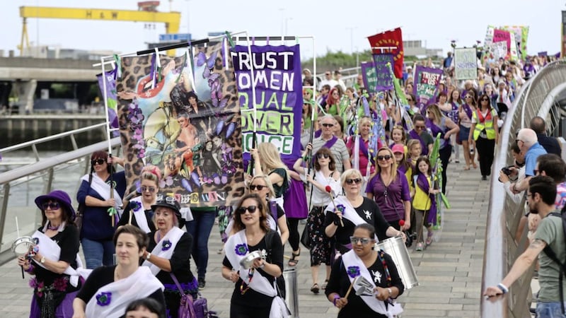 In June, people marched over the River Lagan in Belfast, dressed in green, purple and white &ndash; the colours of the suffragette movement &ndash; to celebrate 100 years since women were granted the vote. Photo: Niall Carson/PA 