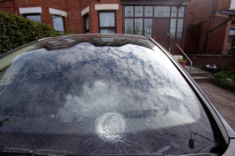 Damage caused to a car parked in Gerry Adams' driveway following an attack on his home. Picture by Mal McCann