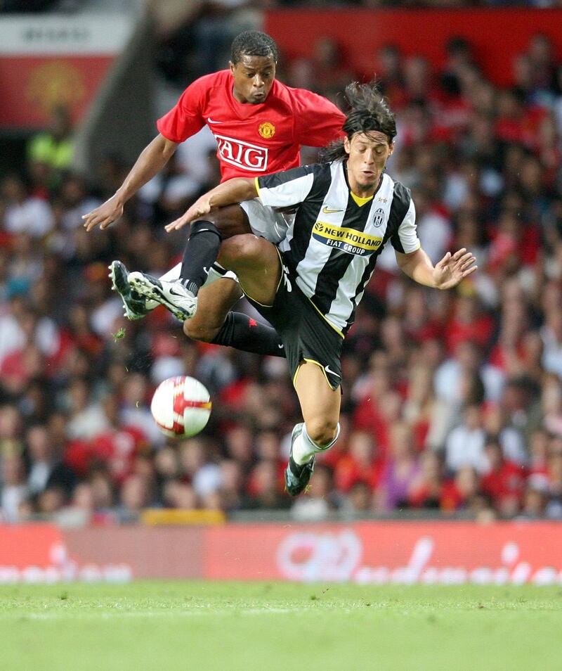 Manchester United's Patrice Evra jumps for the ball with Juventus' Mauro Camoranesi during the pre-season friendly match against Manchester United at Old Trafford Manchester on Wednesday August 6 2008&nbsp;