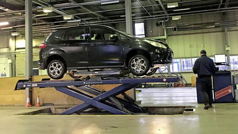 A car on a lift at a MOT Centre in Northern Ireland. Picture: Alan Lewis - PhotopressBelfast.co.uk 