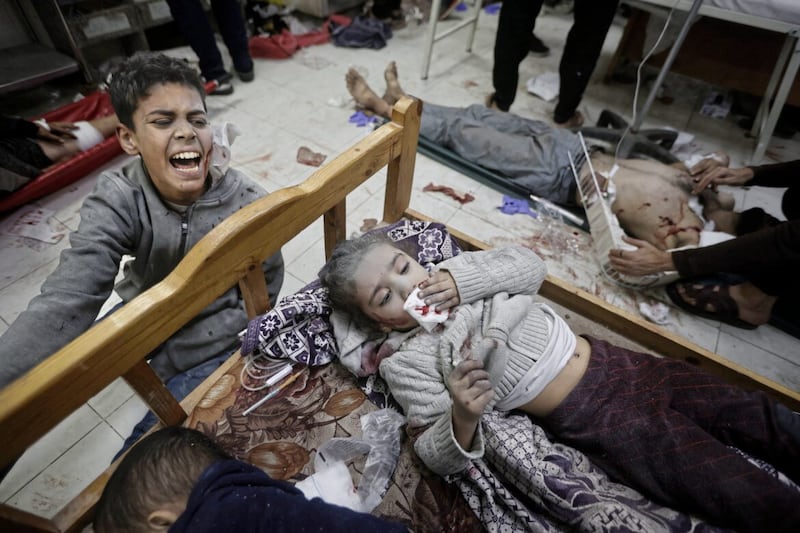 Palestinians wounded in the Israeli bombardment of the Gaza Strip arrive at a hospital in Khan Younis on Friday, Dec. 8, 2023. (AP Photo/Mohammed Dahman). 