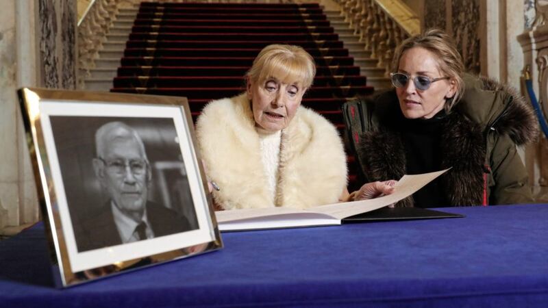 Nobel laureate and peace activist Betty Williams and US actress Sharon Stone, sign a Book of Condolence in memory of former SDLP leader Seamus Mallon in January at Belfast city hall. Picture by Kelvin Boyes/Press Eye 