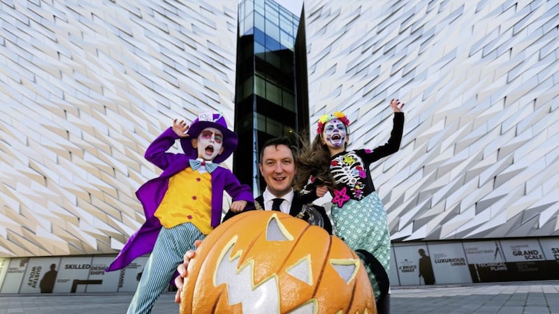 Belfast mayor John Finucane helps launch the Belfast Monster Mash at Titanic Belfast alongside (left to right) Alex Kolaczyk and Aimee Webb 