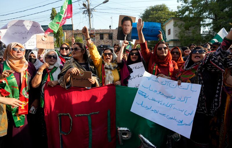Supporters of jailed former Pakistani prime minister Imran Khan’s PTI party protest against the delayed result of the parliamentary election (Fareed Khan/AP)