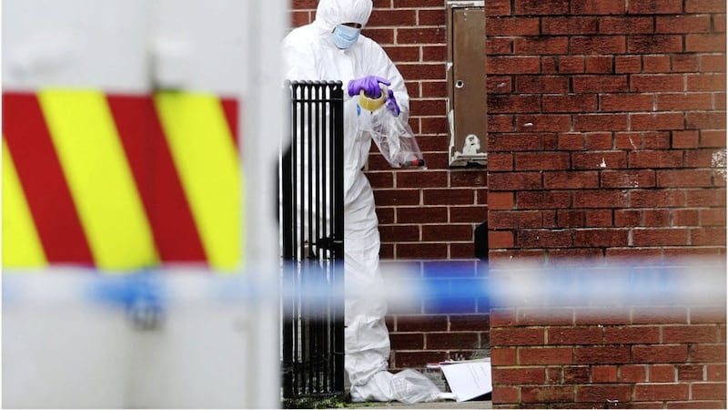 A forensics officer at the scene of a security alert on Little Georges Street in north Belfast. Picture by Hugh Russell 