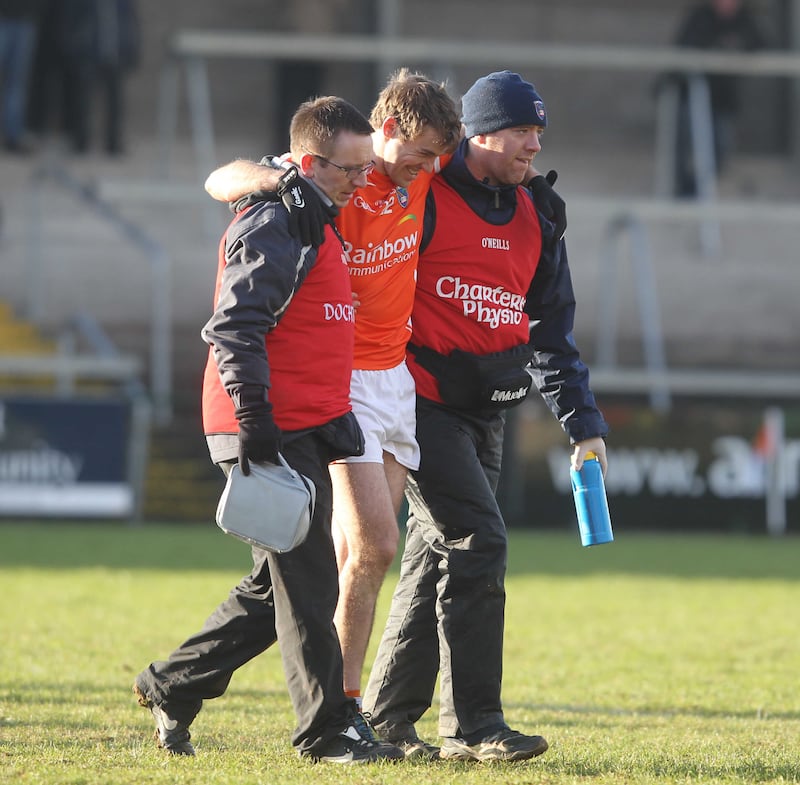 Armagh's Kevin Dyas is helped off the pitch after suffering an injury against Tipperary &nbsp;