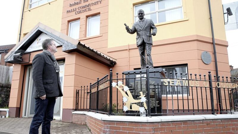 Jim McVeigh pictured beside a statue of James Connolly on the Falls Road in west Belfast 