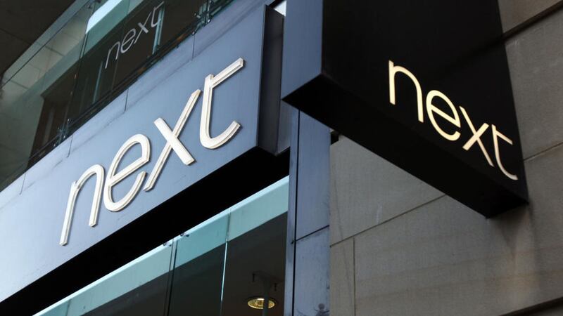 Retailer Next posted lower first half profits after seeing store sales slide and warned trading has remained &quot;challenging and volatile&quot; 