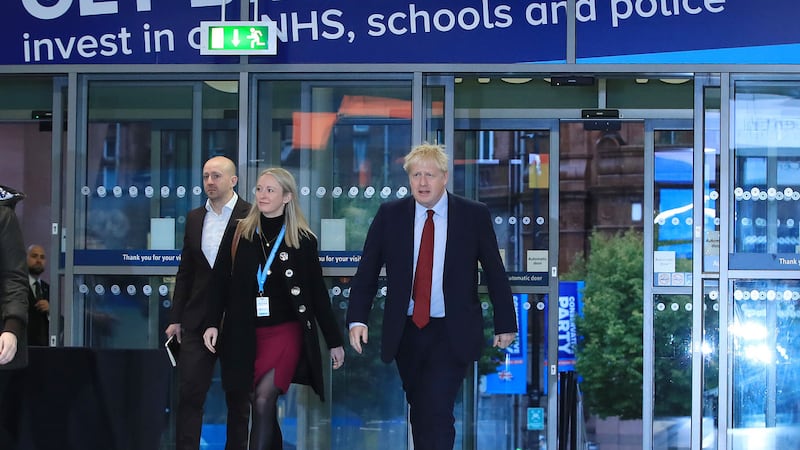 British prime minister Boris Johnson enters the hall to do morning interviews at the Conservative Party Conference in Manchester&nbsp;