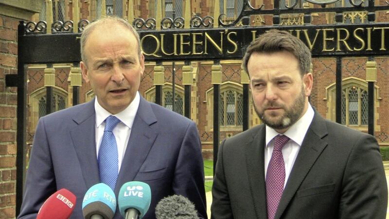 Fianna F&aacute;il leader Miche&aacute;l Martin and SDLP leader Colum Eastwood speaking outside Queen&#39;s University Belfast Picture by Michael McHugh/PA 