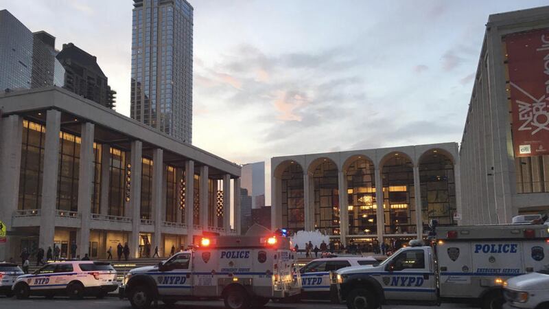 Police respond to New York's Metropolitan Opera which halted a performance after someone sprinkled an unknown powder into the orchestra pit. Picture by Dylan Hayden, Associated Press