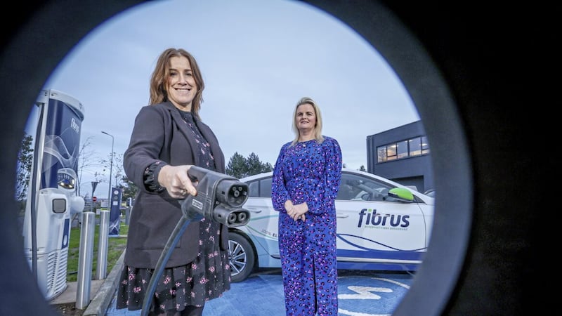 Sharon McGregor, fleet, facilities and office manager at Fibrus, demonstrates the firm&rsquo;s rapid &lsquo;superfast&rsquo; 50KW charging unit to Ciara Campbell, Weev&rsquo;s operations manager. Picture: Matt Mackey/PressEye 