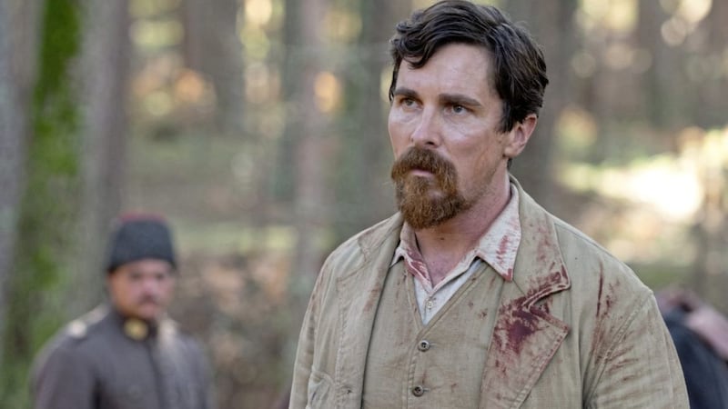 Christian Bale as Chris Myers, a western observer with a conscience, in The Promise 