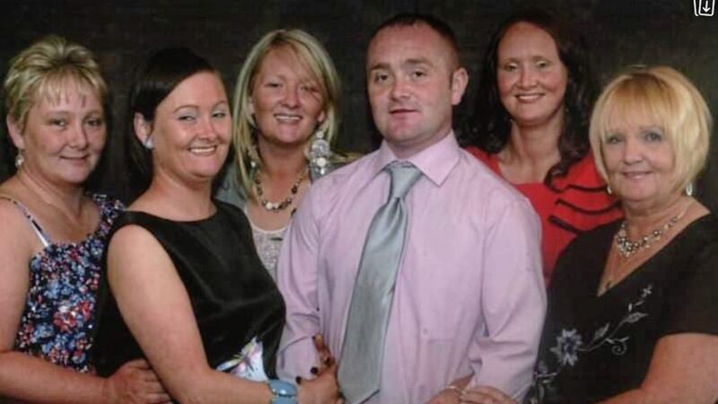 West Belfast man Paul Feeney (centre) pictured with his sisters (left to right), Michelle, Andrea, Paula, and Kylie, and his mother, Rosaleen 