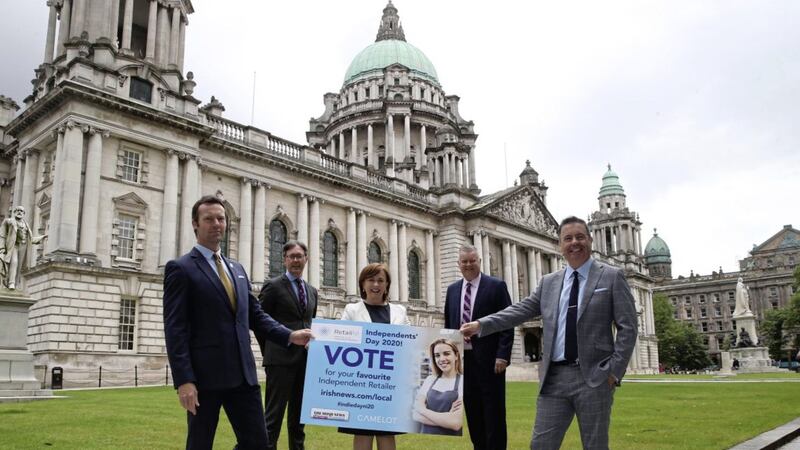 Economy minister Diane Dodds helps launch the People&#39;s Vote campaign, watched by (from left) Gareth Burnside (Camelot), Irish News marketing manager John Brolly and business editor Gary McDonald, and Retail NI chief executive Glyn Roberts. Photo: Hugh Russell 