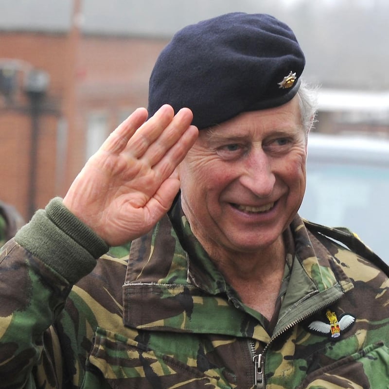 Prince Charles saluting in an Army uniform