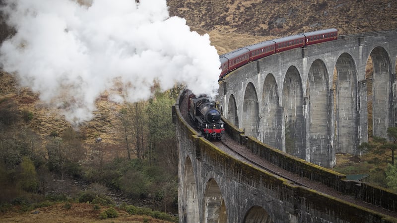 The Jacobite Express of crosses the Glenfinnan Viaduct on its way to Mallaig from Fort William