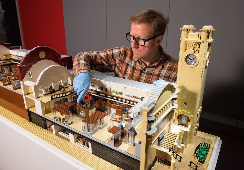 Technician Alistair MacKillop with a Lego model of the Horniman Museum