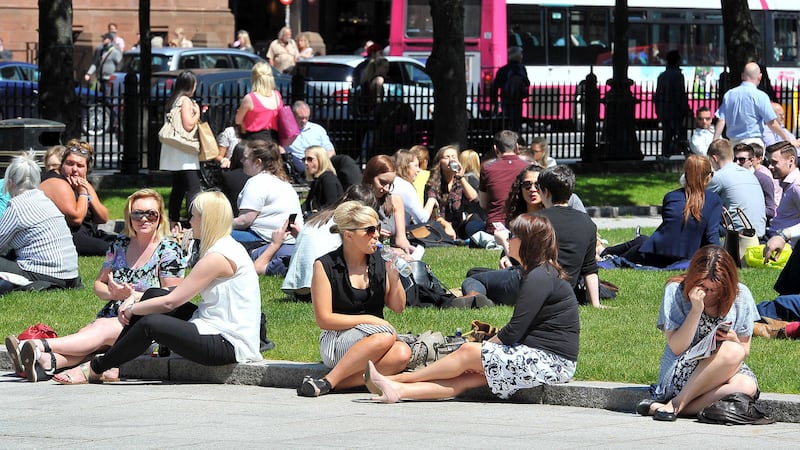 Sunseekers enjoying the sun at Belfast City Hall in 2014&nbsp;