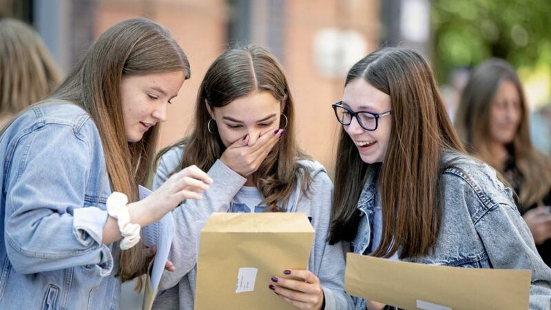 Caroline Moseley, Amber Lord and Zoe Lock open their GCSE results at Robert May&#39;s School in Odiham, Hampshire. Picture by Victoria Jones/PA Wire 