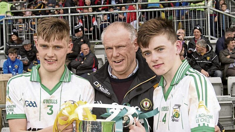 Ulster Council secretary Brian McAvoy with his his twin sons Ardan and Malachai after Burren&rsquo;s Down MFC final win over Clonduff Picture by Tony Bagnall 