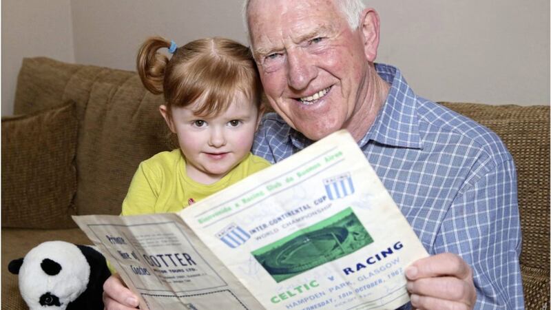 Robert Delaney and three-year-old Amy Gallagher check out the Celtic v Racing programme, produced for the 1967 Inter-Continental Cup World Club Championship. Picture by Hugh Russell