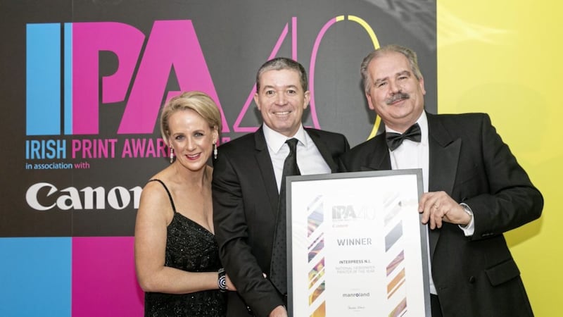 Irish News managing director Dominic Fitzpatrick (centre) receives the award on behalf of Interpress at the Irish Printer Awards held in Dublin&#39;s Aviva Stadium. Included are TV3&#39;s Sybil Mulcahy (event host) and Martin Lockley from sponsors Manroland 