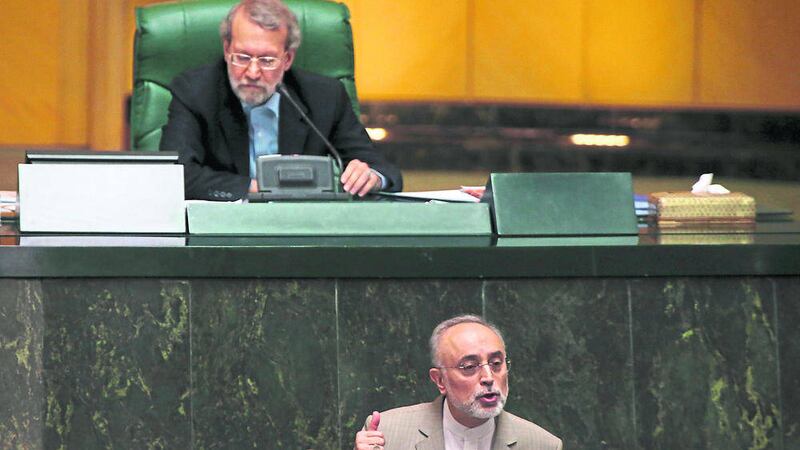 Chief of Iran&#39;s Atomic Energy Organization Ali Akbar Salehi, bottom, addresses parliament while speaker Ali Larijani listens in an open session of parliament in Tehran, Iran yesterday  Picture by PA 