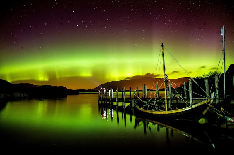 the Northern Lights, or Aurora Borealis, shining over Derwentwater