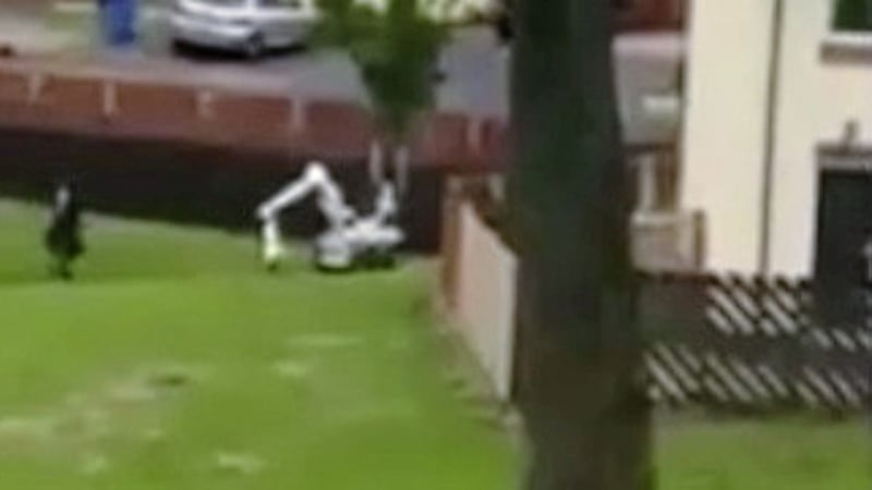 Sharon McCormack had just passed the bomb disposal robot when it exploded a hoax device. Picture taken from video footage by Sean Haslett 
