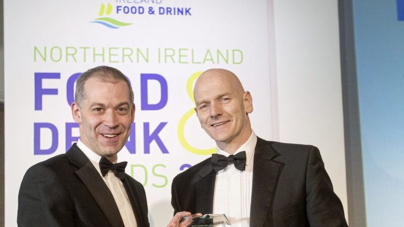 Professor Chris Elliott (right), director of the Institute for Global Food Safety at Queen&rsquo;s University Belfast, receives his Outstanding Contribution Award from Nigel Walsh representing sponsors Ulster Bank 