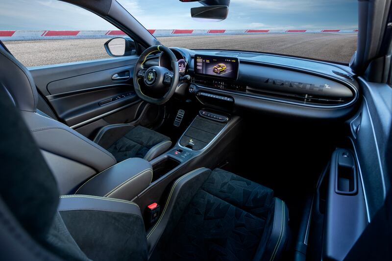 The interior features large bucket seats and a driver-focused design