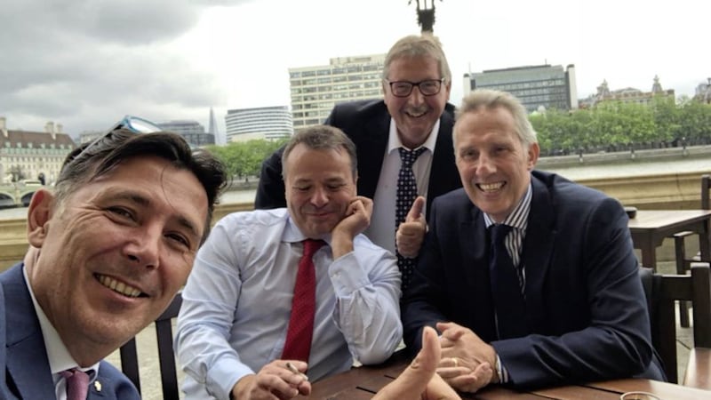Andy Wigmore and Arron Banks with Ian Paisley and Sammy Wilson shortly after walking out of a Commons committee session 